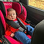 baby, blue_pants, car, car_interior, car_seat, child, child_seat, clothing, cute, indoors, infant, person, portrait, raindrops, red, safety_harness, seat, seatbelt, window, young_child
