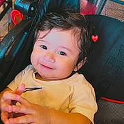 Adriel joined the competition — help win amazing prizes! toddler, child, smiling, hands, stroller, indoor, hair, clothing, seat, face, cute, happy, small_child, infant, baby, portrait, casual, red_heart, expression, seated