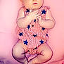baby, infant, child, headband, bow, blanket, pink, clothing, striped, stars, hands, feet, cute, portrait, lying_down, fabric, soft, indoors, skin, expression