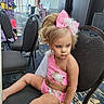 Frankie-Rae joined the competition — help win amazing prizes! bow, carpet, chair, child, costume, dance_costume, earrings, event, fashion, girl, hair_style, indoor, performance, person, pink, seated, serious_expression, sparkles, waiting, young