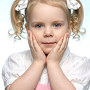 Frankie-Rae is registered to the contest to win money with this photo: child, girl, portrait, pigtails, bows, blue_eyes, hands, white_shirt, pink_dress, cute, innocent, closeup, face, smile, curly_hair, studio_light, soft_background, young, adorable, fashion