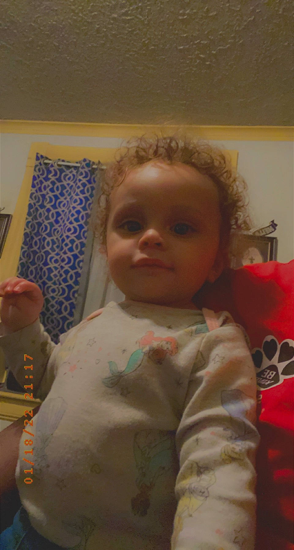 Jada is registered to the contest to win money with this photo: arm, baby, baby_toddler_clothing, cheek, child, chin, eye, eyebrow, face, forehead, hair, head, iris, lip, mouth, nose, person, room, skin, sleeve