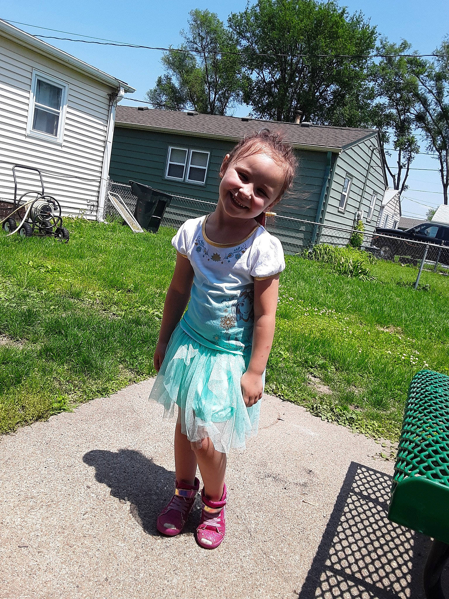 Aaralyn is registered to the contest to win money with this photo: backyard, child, dress, fun, garden, grass, green, home, joy, leisure, person, plant, play, recreation, shoe, summer, t_shirt, toddler, tree, vacation