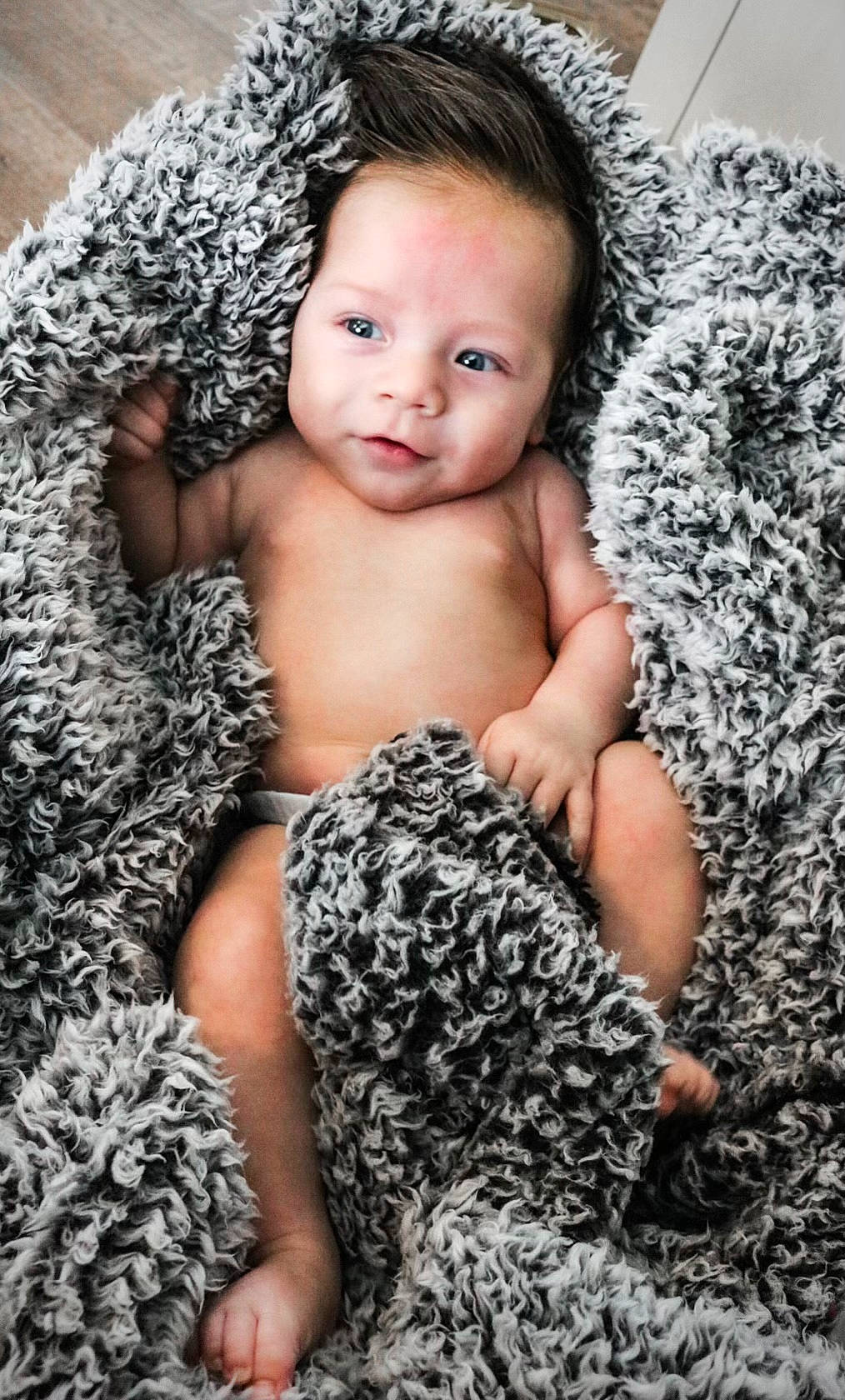 Emmett is registered to the contest to win money with this photo: abdomen, arm, baby, baby_toddler_clothing, chest, comfort, eye, eyelash, facial_expression, finger, flash_photography, foot, happy, head, human_body, human_leg, person, skin, thigh, toddler