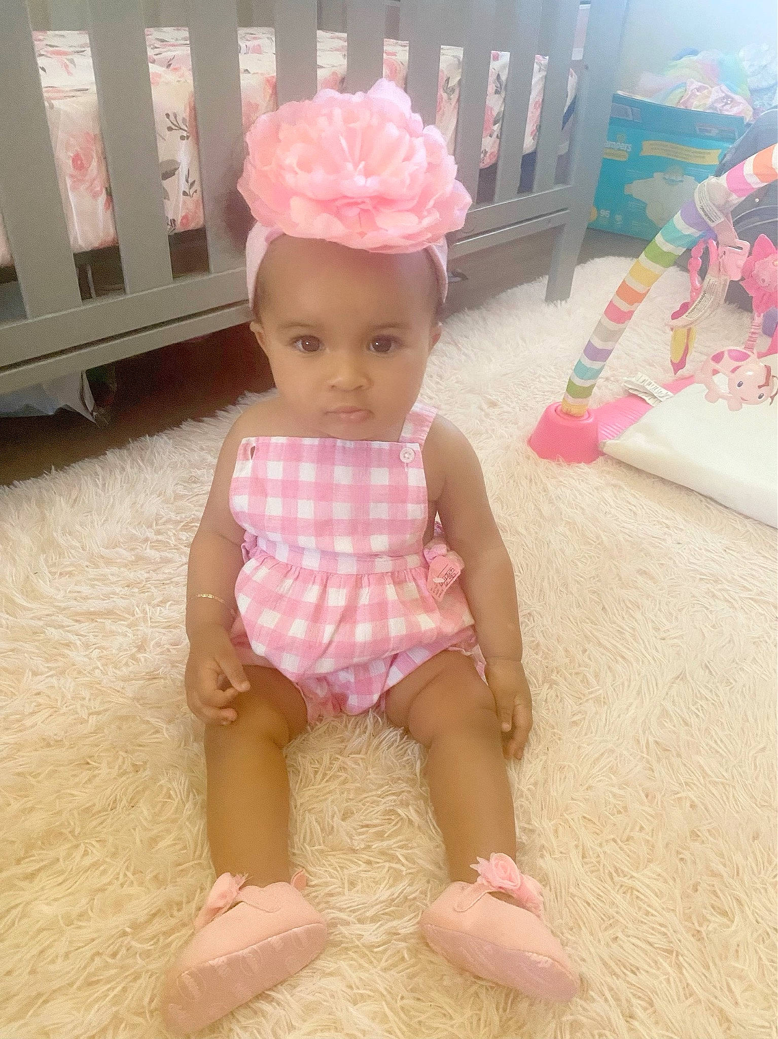 Natalia is registered to the contest to win money with this photo: baby, baby_toddler_clothing, child, dress, fashion_accessory, flooring, foot, hat, headpiece, human_leg, pattern, peach, person, pink, skin, sleeve, sock, textile, thigh, toddler