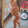 Matteo is registered to the contest to win money with this photo: baby, toddler, diaper, indoor, tile_floor, bread, child, toy_wagon, fan, curious, standing, barefoot, window, glass_door, candid, light, home, cute, food, play