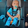 Matteo is registered to the contest to win money with this photo: toddler, child, car_seat, pacifier, toy_bus, blue_pajamas, car_interior, seatbelt, child_safety, vehicle, window, seat, person, baby, monsters, clothing, sitting, young_child, indoor, casual