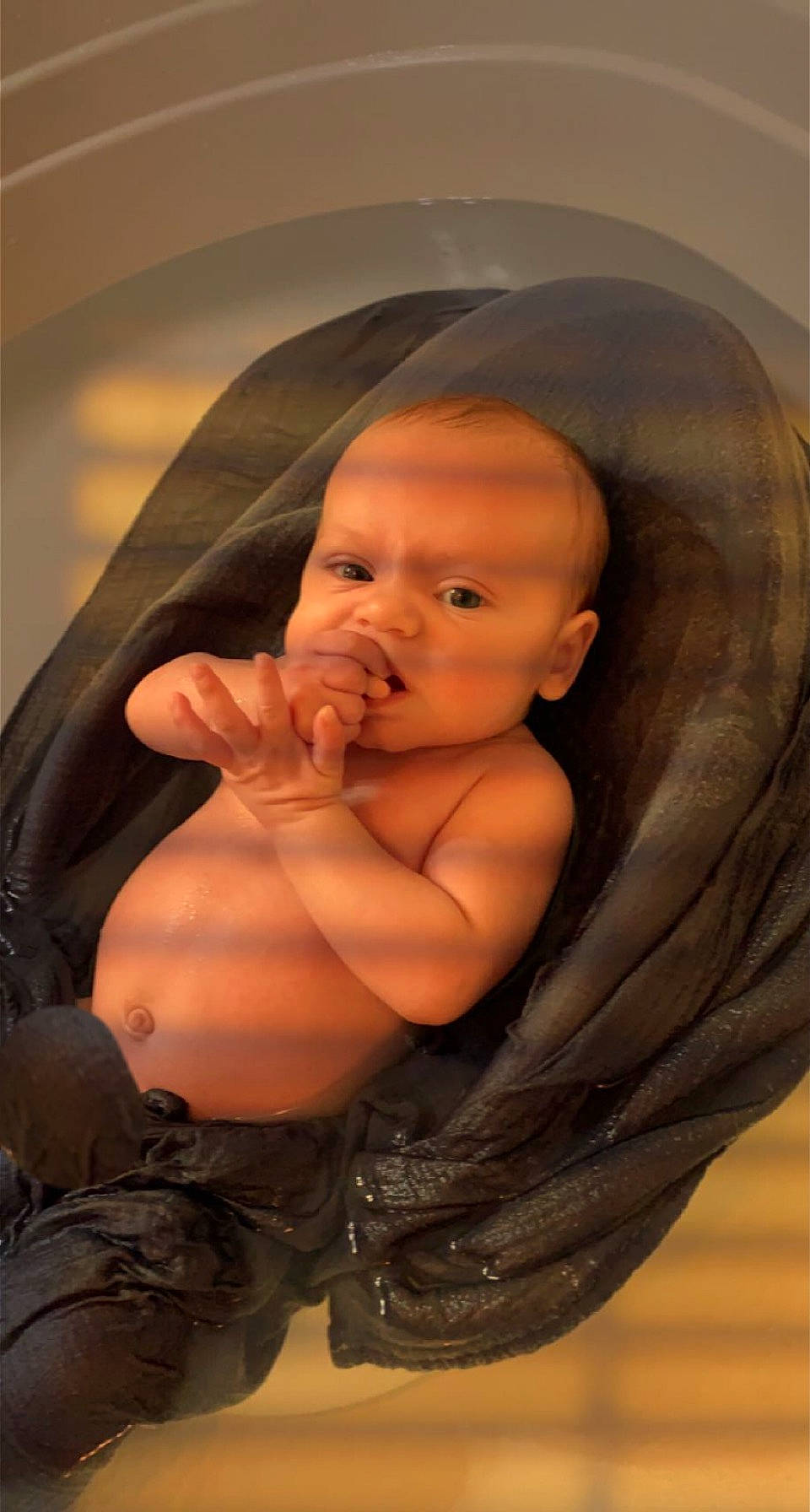 Parker is registered to the contest to win money with this photo: baby, cheek, chest, ear, eye, eyebrow, eyelash, finger, flash_photography, forehead, gesture, human_body, jaw, leg, lip, mouth, neck, nose, person, stomach