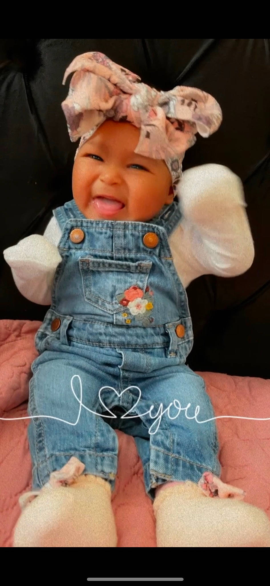 Legacy is registered to the contest to win money with this photo: baby, baby_products, baby_toddler_clothing, blue, cap, cheek, child, chin, denim, doll, happy, hat, headwear, pattern, person, pink, sitting, skin, sleeve, smile