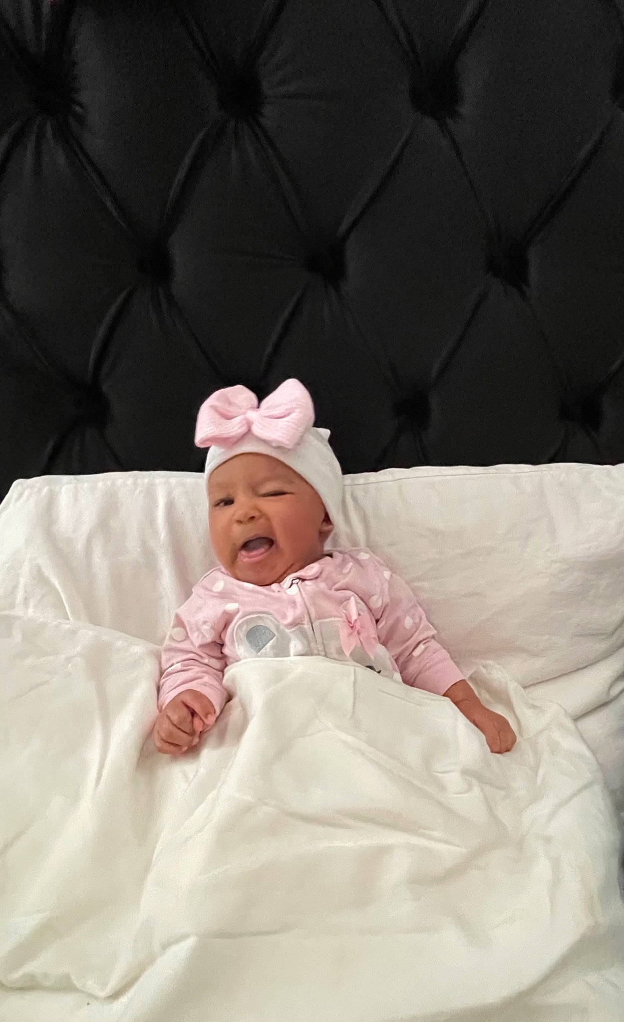 Legacy is registered to the contest to win money with this photo: baby, baby_products, baby_toddler_clothing, cheek, child, comfort, event, fashion_accessory, flash_photography, fun, grass, happy, head, headwear, linens, person, portrait_photography, room, sitting, sleeve