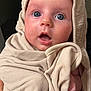 baby, infant, face, eyes, expression, blanket, cloth, hood, skin, person, closeup, cute, newborn, soft, wrapped, surprised, indoors, portrait, human, child