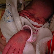 Daisy is registered to the contest to win money with this photo: baby, blanket, care, closeup, clothing, hand, healthcare, hospital, human, infant, nasal_tube, newborn, person, portrait, rest, skin, sleeping, soft, toddler, wrapped