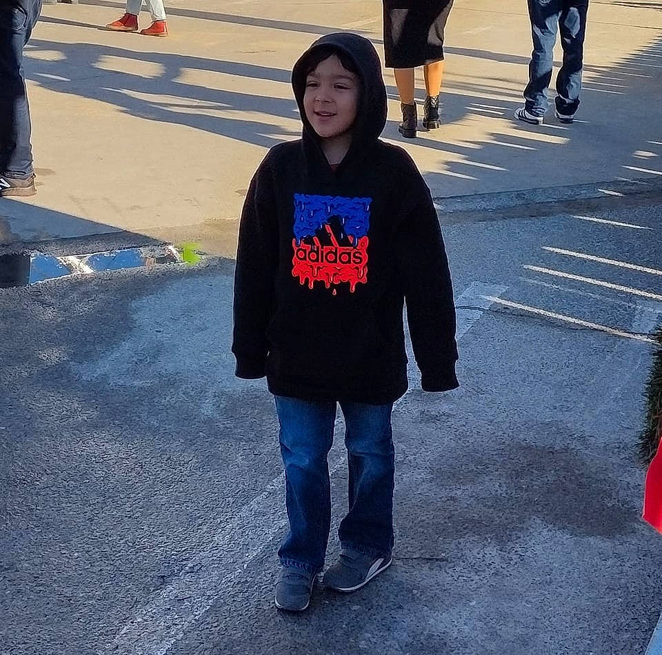 Jonny is registered to the contest to win money with this photo: asphalt, cool, denim, electric_blue, event, fun, gesture, headwear, human_leg, joy, leg, pedestrian, person, public_space, road, road_surface, sidewalk, sleeve, street, street_fashion