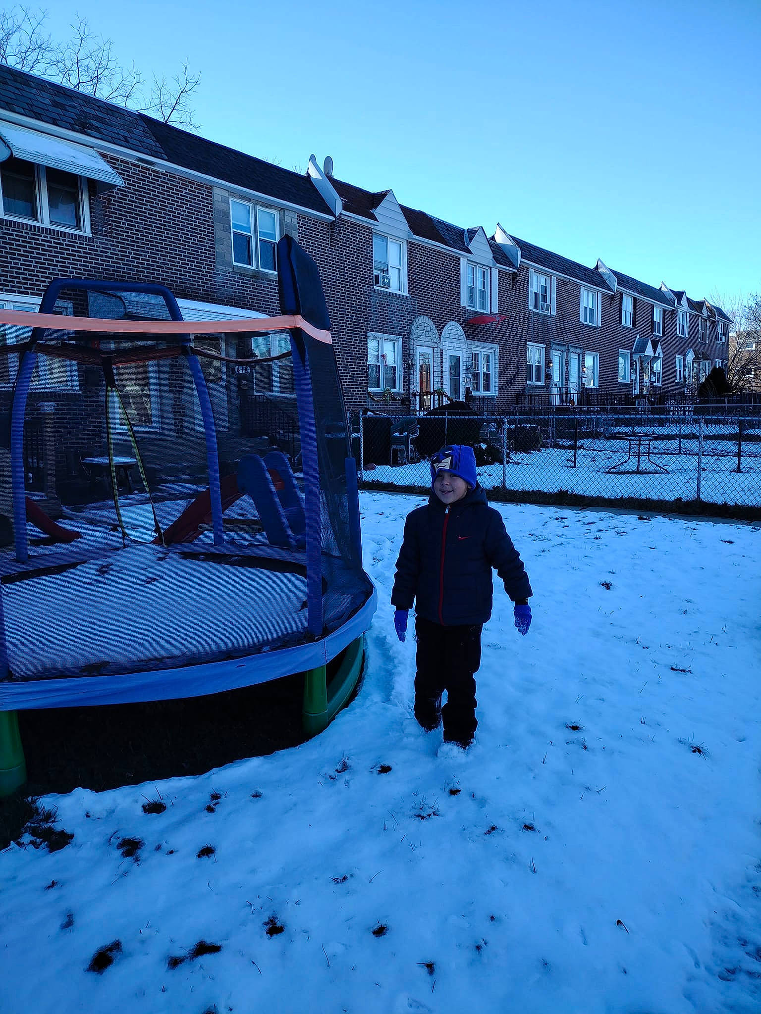 Jonny joined the competition — help win amazing prizes! blue, building, city, electric_blue, freezing, headwear, house, jacket, joy, leisure, person, roof, sky, slope, snow, street_light, sunlight, tints_and_shades, travel, tree