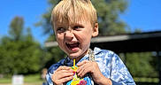 Denver joined the competition — help win amazing prizes! blue_sky, boy, casual_clothing, child, daylight, drink, fun, greenery, happy, hoodie, juice_pouch, leisure, nature, outdoor, person, playful, portrait, smiling, sunlight, tree
