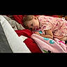 Winter joined the competition — help win amazing prizes! toddler, child, pacifier, blanket, striped_dress, indoor, laying_down, cozy, colorful, soft, comfort, resting, cute, young_child, fabric, bed, casual, relaxed, person, infant