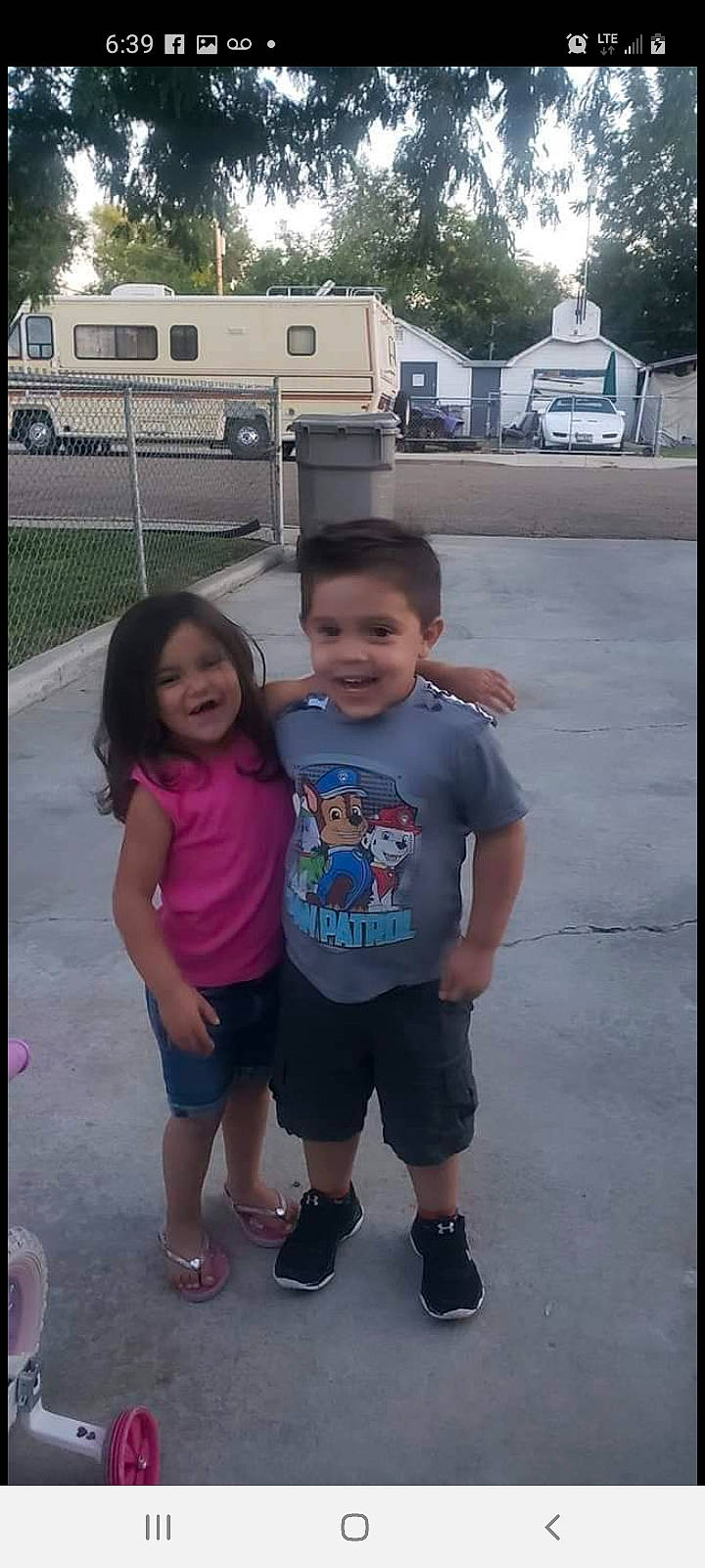 Kaylee is registered to the contest to win money with this photo: asphalt, automotive_exterior, car, child, event, fun, happy, joy, leisure, motor_vehicle, person, plant, recreation, shorts, smile, t_shirt, toddler, travel, tree, truck