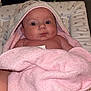 Nevaeh-Leigh is registered to the contest to win money with this photo: baby, infant, towel, pink, blanket, hood, face, eyes, skin, mouth, expression, person, child, indoor, soft, texture, star_pattern, changing_pad, comfort, wrapped