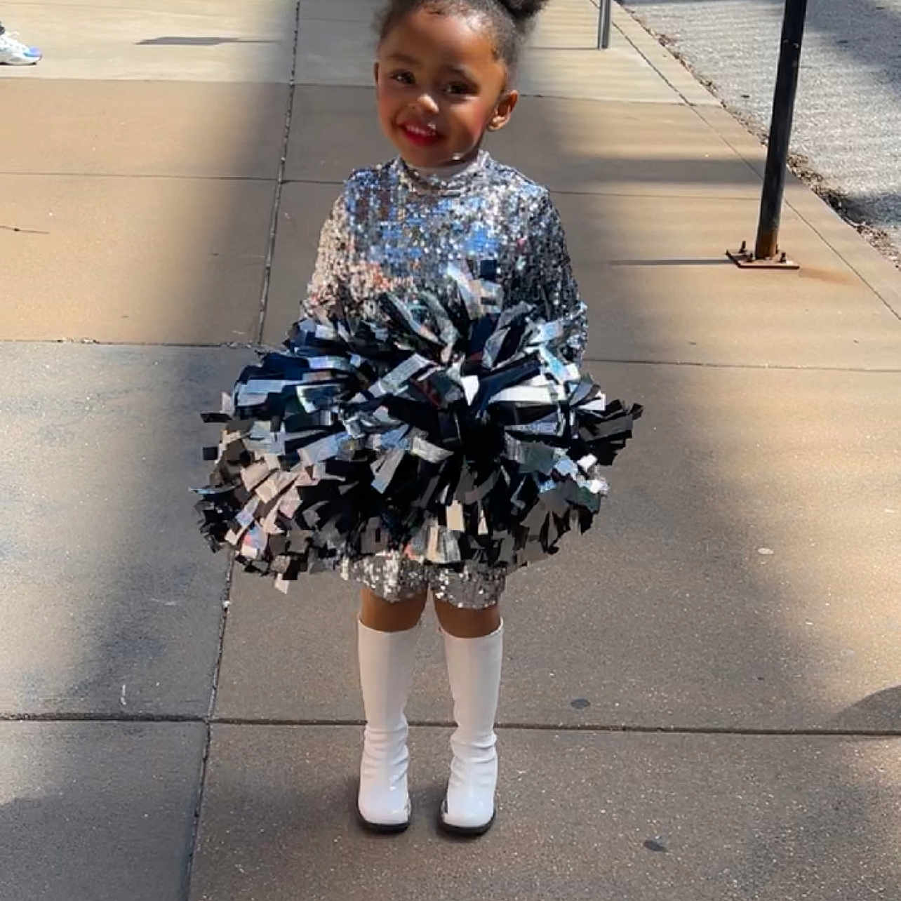 Arie Allen is registered to the contest to win money with this photo: child, city, clothing, coat, dress, face, female, footwear, girl, head, jacket, person, photography, portrait, road, shoe, shorts, skirt, street, urban