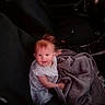 baby, blanket, car_interior, car_seat, child, clothing, cute, dashboard, fabric, happy, indoor, infant, person, portrait, red_hair, seat, seatbelt, smiling, steering_wheel, window