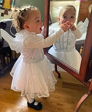 Delilah is registered to the contest to win money with this photo: baby, baby_toddler_clothing, blond, child, dance, dress, event, flooring, fun, gesture, hair, hairstyle, happy, head, human_body, person, shoulder, skin, smile, standing