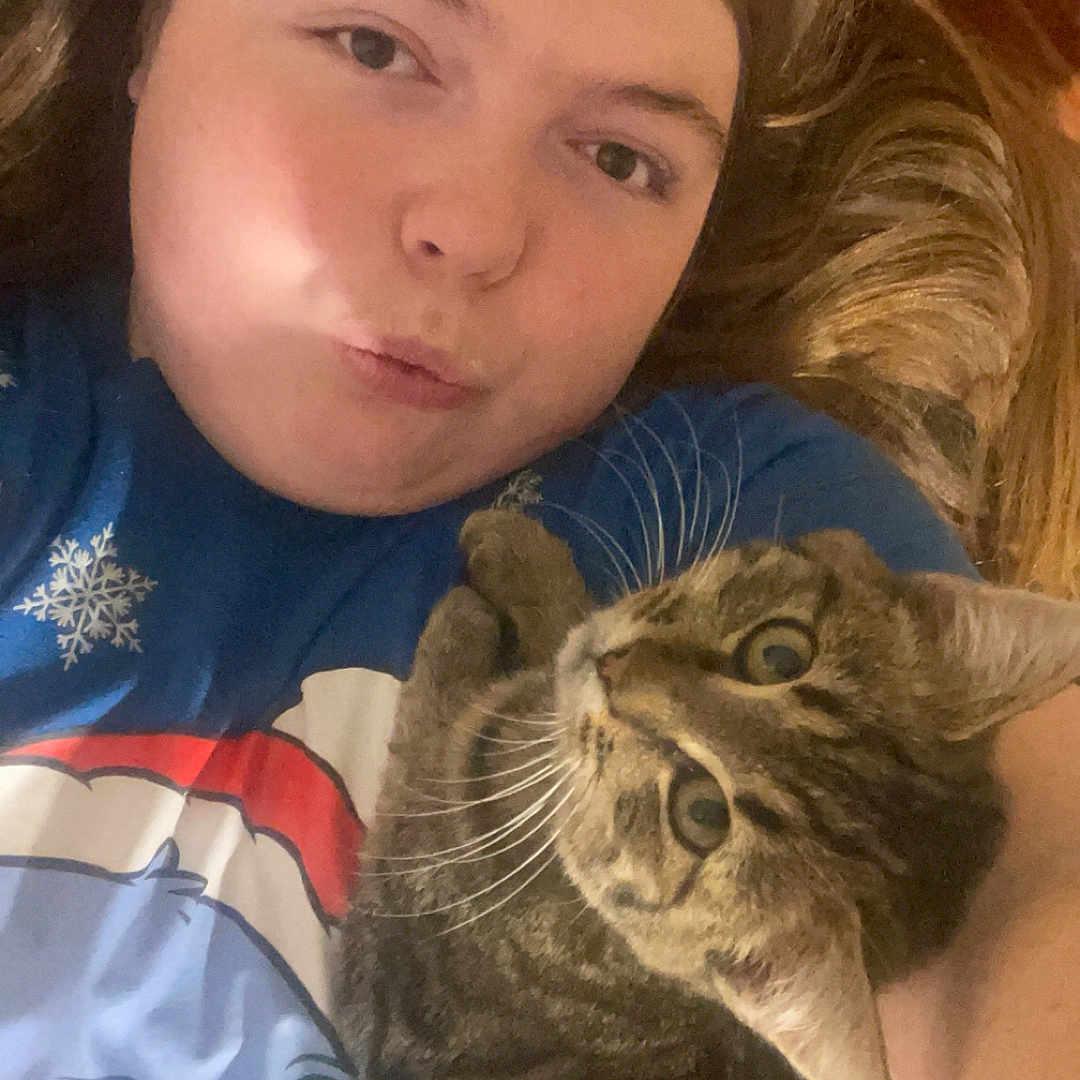 Molly is registered to the contest to win money with this photo: abyssinian, animal, blanket, cat, child, couch, cushion, face, female, girl, head, homedecor, kitten, manx, person, pet, photography, portrait, selfie, sleeping