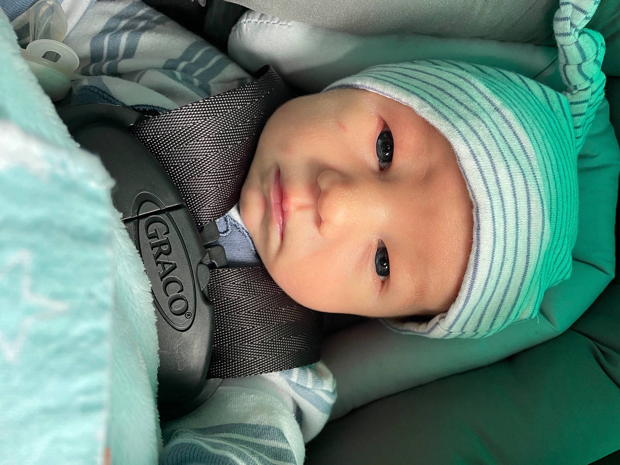 Jasper is registered to the contest to win money with this photo: baby, baby_toddler_clothing, cap, cheek, child, comfort, cool, eyebrow, eyelash, grass, headwear, knit_cap, lip, mouth, nose, person, skin, sleeve, textile, toddler