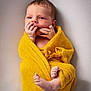 baby, child, cozy, cute, expression, face, feet, fingers, hands, infant, knit, lying_down, newborn, portrait, skin, small, soft_background, warm, wrapped, yellow_blanket