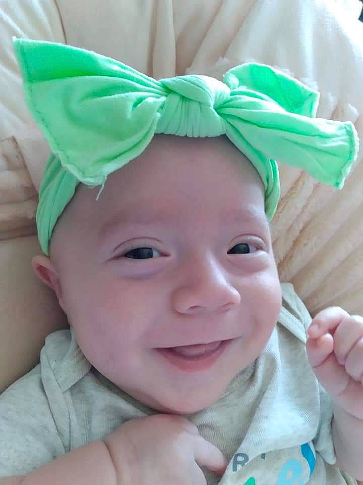 Brilee is registered to the contest to win money with this photo: baby, baby_toddler_clothing, cheek, child, eye, eyebrow, face, fun, gesture, green, happy, head, headwear, iris, joy, lip, nose, person, photograph, pink