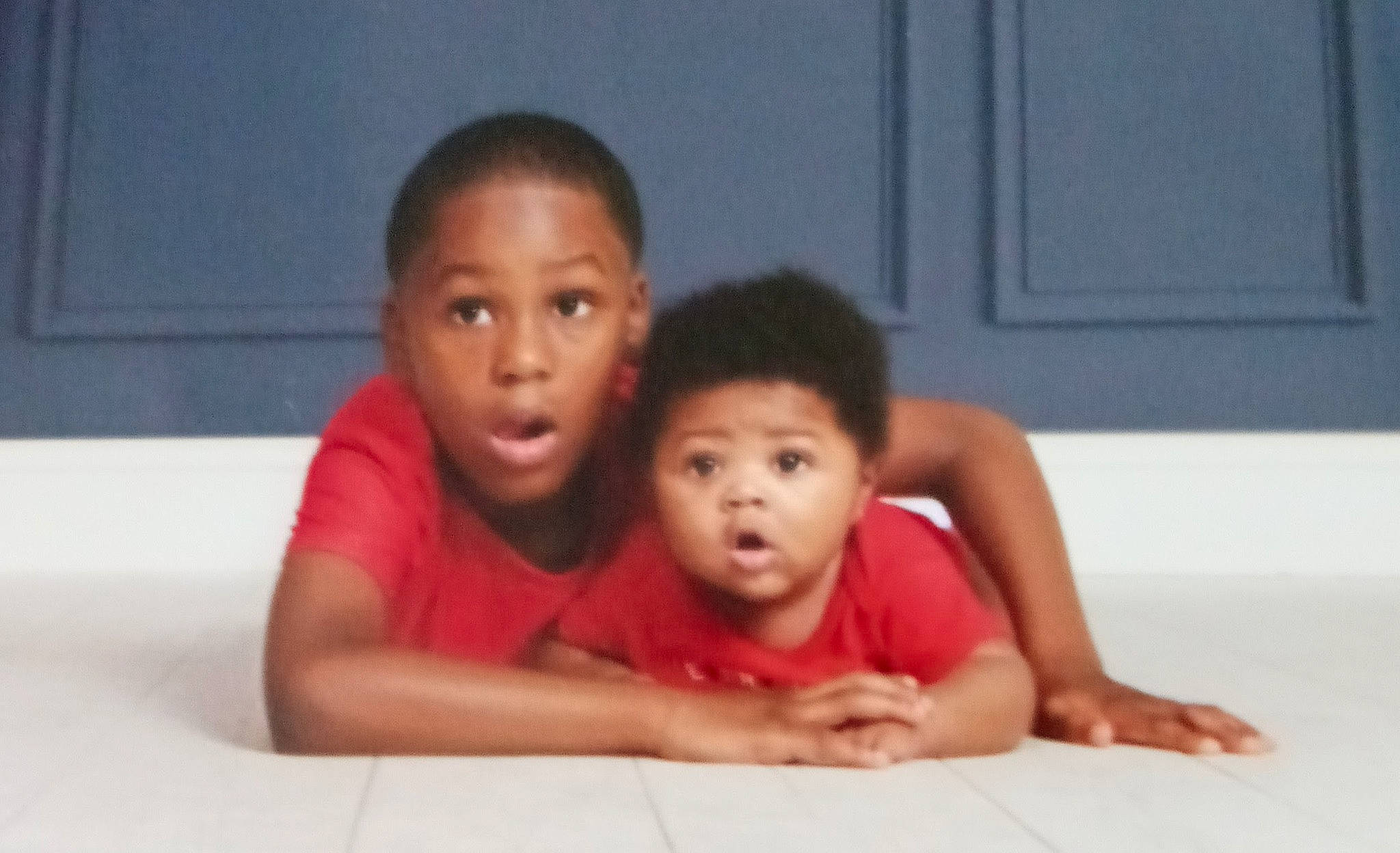 Treyvon joined the competition — help win amazing prizes! baby, baby_toddler_clothing, cheek, child, comfort, event, finger, flash_photography, flooring, fun, gesture, happy, leisure, mouth, nose, person, room, sitting, surprise, t_shirt