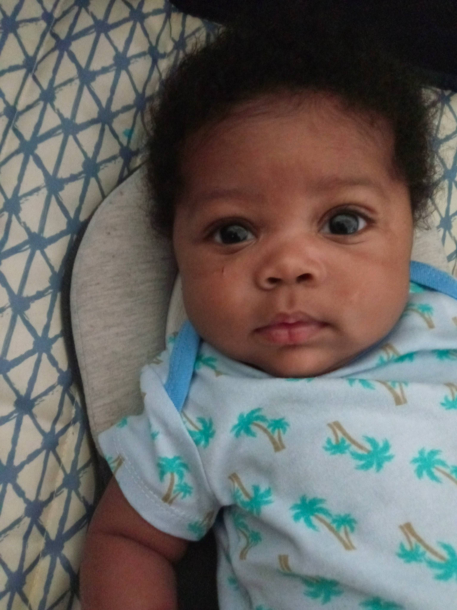 Jayden is registered to the contest to win money with this photo: baby, baby_toddler_clothing, black_hair, cheek, child, chin, comfort, eyebrow, eyelash, facial_expression, forehead, happy, iris, linens, lip, mouth, nose, person, skin, sleeve