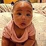 Isla joined the competition — help win amazing prizes! baby, infant, child, cute, pigtails, pink_clothing, bed, pillow, expression, surprised, skin, hand, foot, indoors, home, soft, cushion, person, portrait, sitting
