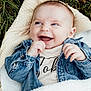 Tobie is registered to the contest to win money with this photo: baby, smiling, denim_jacket, blanket, grass, outdoor, happy, infant, clothing, cute, child, portrait, face, hands, nature, warm, cozy, toddler, laughing, expression