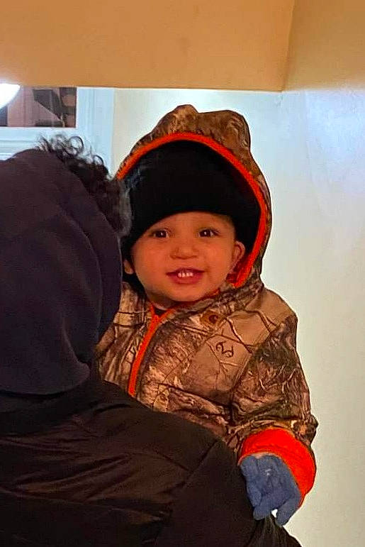 Jalen joined the competition — help win amazing prizes! baby, cap, child, eye, fashion_accessory, freezing, fun, glove, happy, headgear, headwear, hoodie, jacket, landscape, person, personal_protective_equipment, sitting, sleeve, smile, toddler