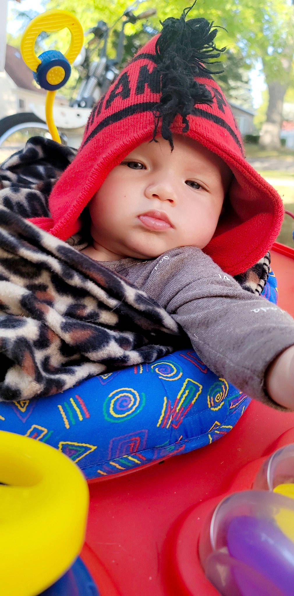 Cash joined the competition — help win amazing prizes! beanie, cap, child, electric_blue, face, fashion_accessory, fun, fur, happy, headwear, hoodie, knit_cap, leisure, pattern, person, plaid, portrait_photography, recreation, sitting, textile