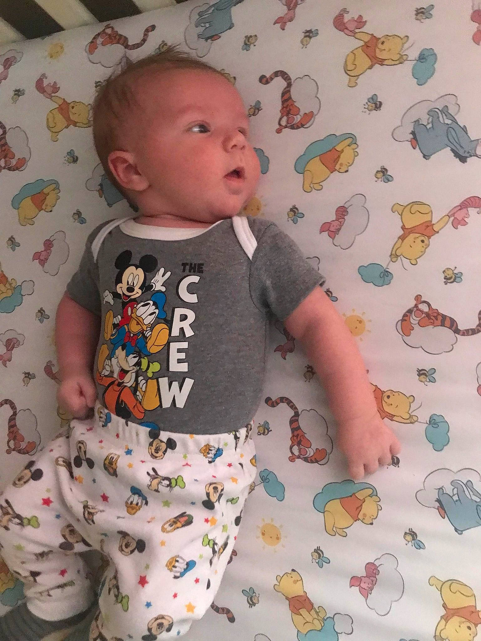 Loki is registered to the contest to win money with this photo: active_pants, baby, baby_toddler_clothing, child, face, facial_expression, green, hairstyle, head, orange, pattern, person, pink, product, skin, sleeve, t_shirt, textile, toddler, white