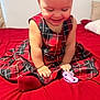 Sophia Lana joined the competition — help win amazing prizes! baby, child, girl, dress, plaid, red_bow, headband, socks, pacifier, bed, bedspread, smile, happy, indoor, infant, clothing, cute, sitting, person, young