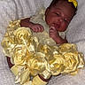 Serenity joined the competition — help win amazing prizes! baby, infant, yellow_dress, yellow_bow, yellow_socks, flower_dress, soft_blanket, portrait, cute, newborn, indoors, child, adorable, resting, cozy, small_hands, sleepy_eyes, fabric, closeup, person
