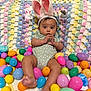 Milani is registered to the contest to win money with this photo: baby, bunny_ears, easter_eggs, crocheted_blanket, toy_bunny, infant, colorful, plastic_eggs, pastel_colors, cute, indoors, lying_down, headband, onesie, soft_toys, child, holiday, celebration, festive, smiling
