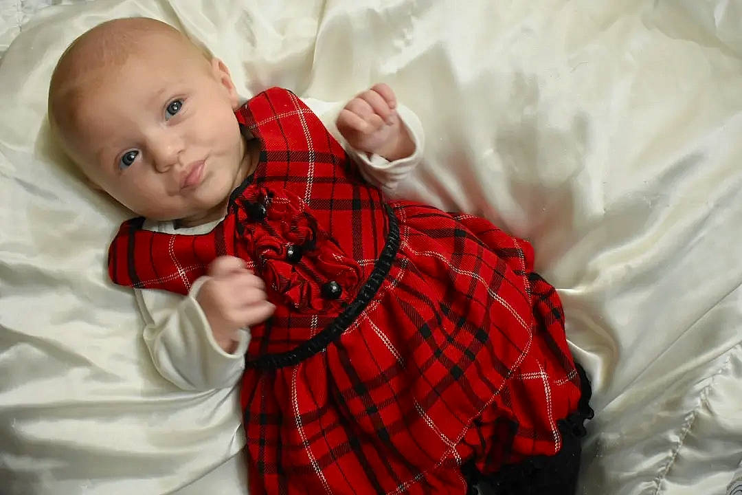 Leia joined the competition — help win amazing prizes! baby, baby_toddler_clothing, child, collar, comfort, dress, dress_shirt, event, happy, linens, pattern, peach, person, plaid, portrait_photography, room, sitting, sleeve, tartan, toddler