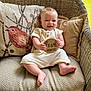 Leland is registered to the contest to win money with this photo: baby, infant, smiling, wicker_chair, cushion, pillow, wooden_sign, five_months, outdoor, greenery, happy, child, sitting, cute, natural_light, comfortable, clothing, skin, face, hand