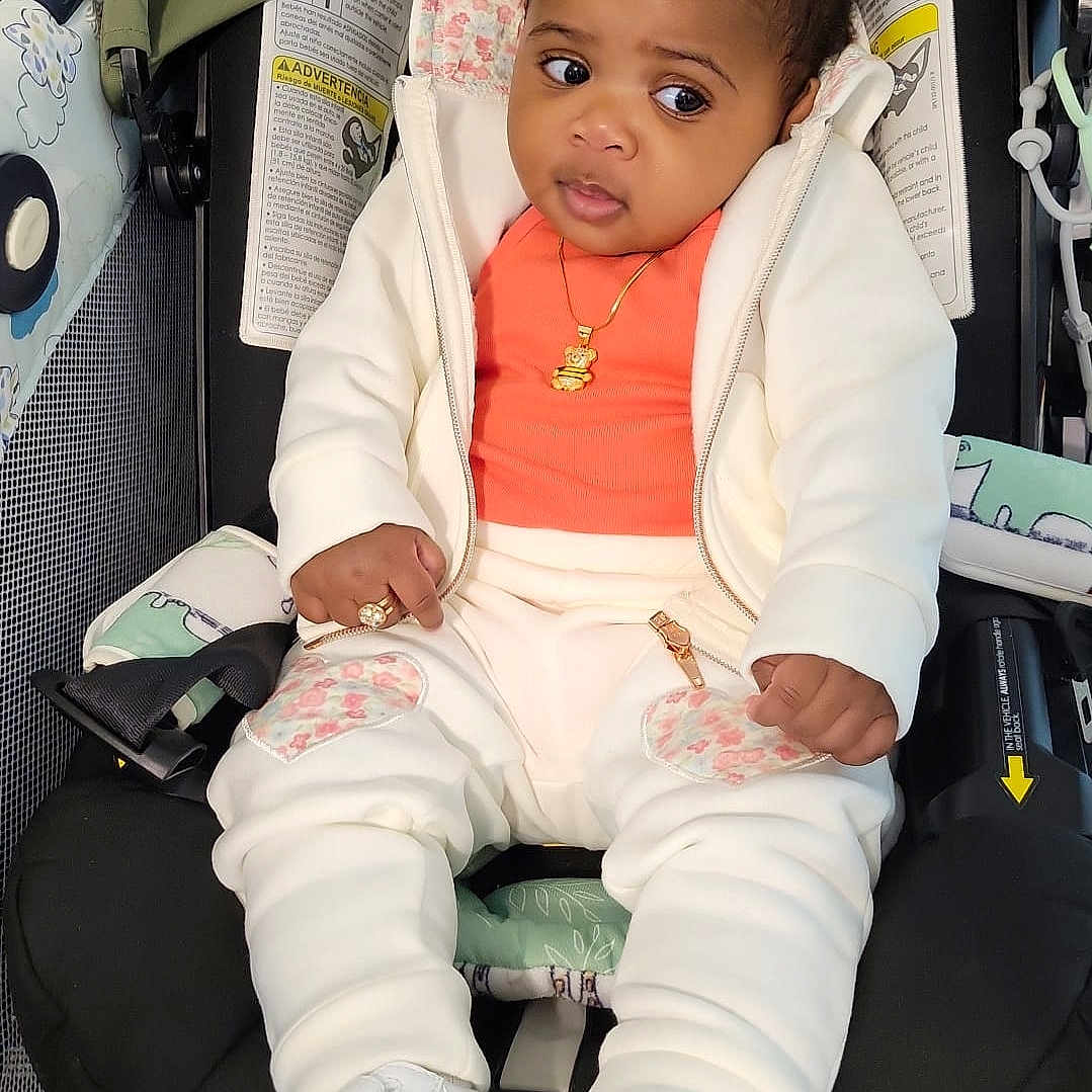 Jai-Ann joined the competition — help win amazing prizes! accessories, baby, blazer, clothing, coat, cushion, face, footwear, head, homedecor, jacket, jewelry, necklace, pants, person, photography, portrait, shoe, sitting, sunglasses