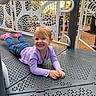 Novaleigh joined the competition — help win amazing prizes! casual, child, hands, happy, jeans, lying_down, metal_platform, outdoor, park, perforated_panel, pink_shoes, play_equipment, playground, portrait, purple_shirt, railing, smile, sunlight, toddler, trees