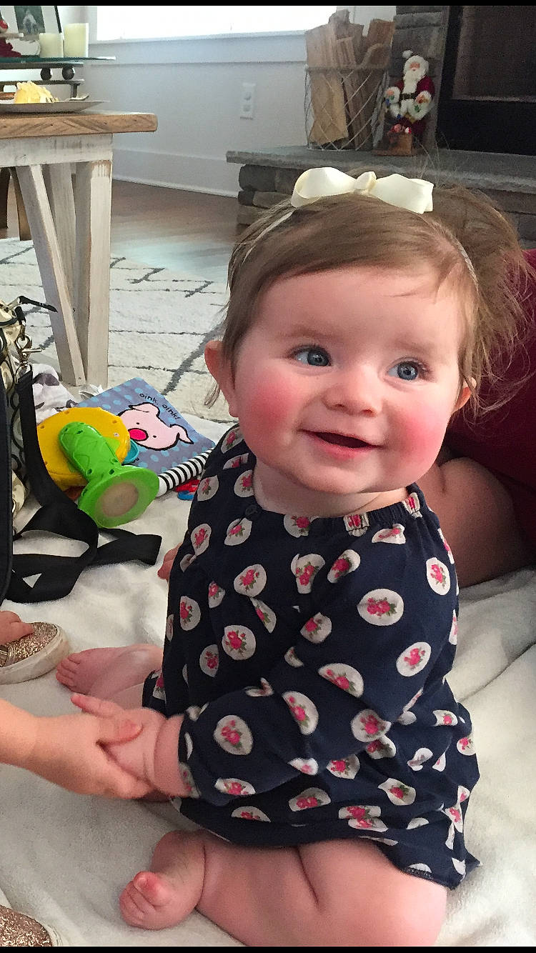 Camille is registered to the contest to win money with this photo: cheek, child, day, girl, head, infant, joy, pattern, person, product, sitting, skin, toddler