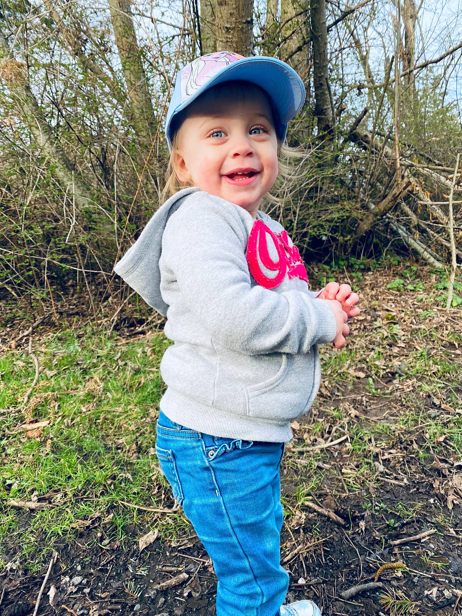 Delilah joined the competition — help win amazing prizes! baby_toddler_clothing, cap, clothing, cool, electric_blue, eye, face, finger, fun, grass, grass_family, grassland, happy, headwear, pattern, people_in_nature, person, plant, sleeve, smile