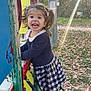 child, girl, playground, climbing, smiling, pigtails, outdoor, autumn, leaves, sunlight, happy, dress, sandals, nature, trees, play_equipment, daylight, fun, park, excited