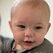 Wayne is registered to the contest to win money with this photo: baby, infant, child, face, nose, snot_bubble, drool, eyes, cheeks, mouth, hair, ear, close_up, portrait, indoor, soft_light, bokeh, clothing, cute, smiling