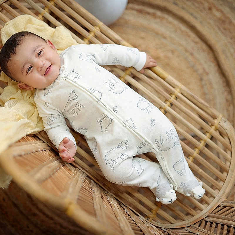Shreyaan is registered to the contest to win money with this photo: animal_print, baby, child, cozy, cute, face, floor_rug, happy, head, indoor, infant, newborn, onesie, portrait, rattan_bassinet, relaxing, smiling, soft_fabric, woven_furniture, yellow_blanket