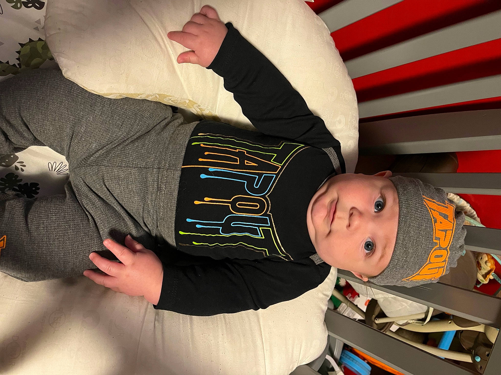 Wyatt is registered to the contest to win money with this photo: baby, carmine, child, cool, elbow, headwear, person, sitting, sleeve, t_shirt, toddler, wrist