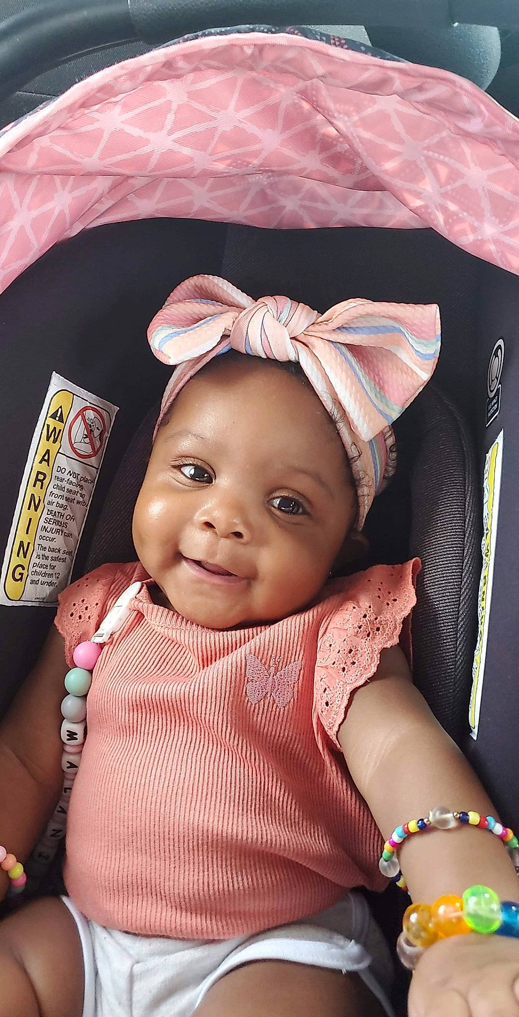 Malani is registered to the contest to win money with this photo: baby, baby_toddler_clothing, brown, cheek, child, chin, cool, eyebrow, eyelash, happy, headgear, iris, lip, magenta, person, pink, product, skin, smile, textile